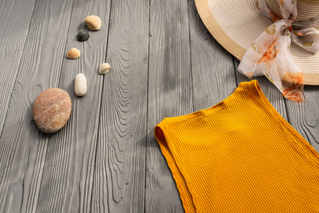 beachwear orange woman top outfit hat bag sun protection sunglasses pebbles. Summer background template mockup free space composition sample text. Top view above wooden background vacation conceptの写真素材