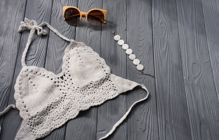 white knitted top woman trending two-piece swimsuit beach swimwear fashion sunglasses. Summer...