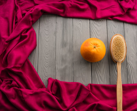 skin preparation body beach anti-cellulite massage cactus brush big orange peel. Summer background template mockup free space pattern composition sample text. Top view above grey wooden backgroundの写真素材