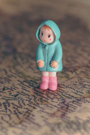 miniature of girl stand on the map of macro photographyの写真素材