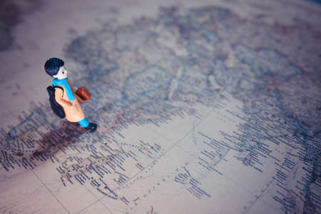 miniature of boy walk on the map of macro photographyの写真素材