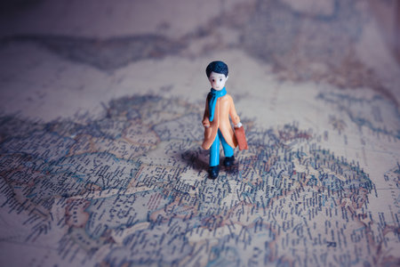 miniature of boy walk on the map of macro photography