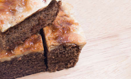 Toffee Cake on wooden plateの写真素材