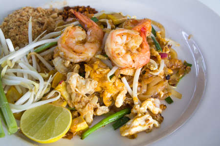 Pad Thai with Shrimps (Thai Traditional Food) on white plateの写真素材
