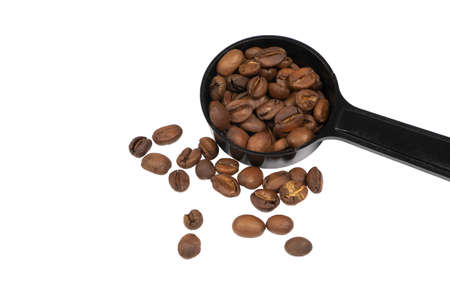 Fully Roasted Coffee Beans in the spoon  isolate on white backgroundの写真素材