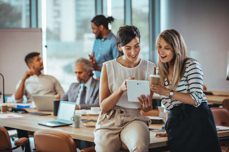 Group of young business people working together in modern office. Selective focus.の写真素材