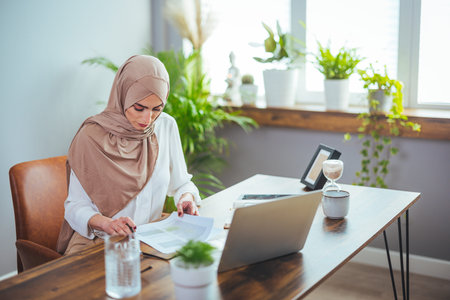 Portrait of her she nice-looking attractive lovely confident cheerful cheery muslim lady working at...