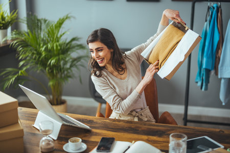 Smiling young woman working at home