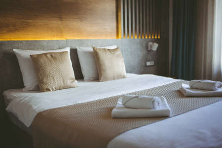 Beautiful luxury pillow on bed decoration in bedroom interior - Vintage Light Filterの写真素材