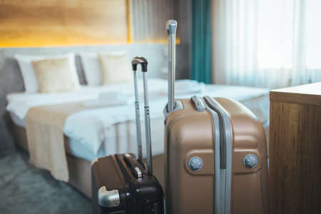 Suitcases in hotel room. Travel, vacation, holiday conceptの写真素材