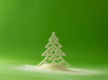 Winter white minimal concept on a green background. Christmas creative idea.の写真素材