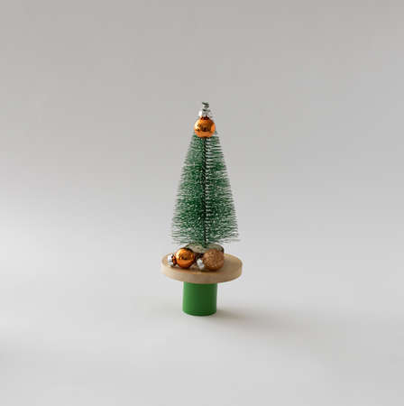 New Year's tree with golden decorations on a purple background. Minimal Christmas idea.の写真素材