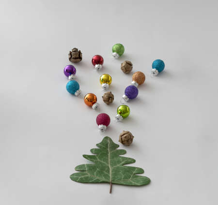 New Year's tree with golden decorations on a purple background. Minimal Christmas idea.の写真素材