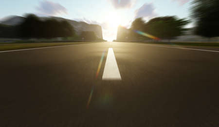 Driving through the forests and mountains in the sunsetの写真素材