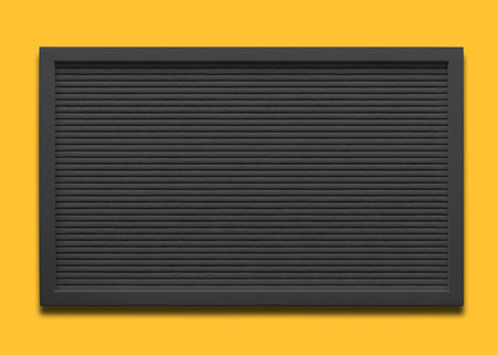 Empty black message board on the yellow background