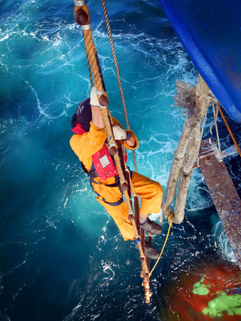 Seaman going down the ladderの写真素材