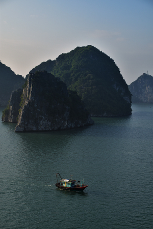 Fishing boat in Halong bay, Vietnam. Earlty mornng.の写真素材