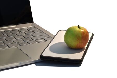 An apple pooping out of the mobile phone screen. Concept for fake product.の写真素材