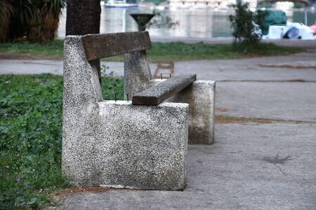 Vandalised bench in a park very dangerous for kids and adults.の写真素材