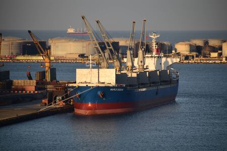 cargo ship in the port during cargo operation. Photo taken in Taichung, Taiwan.のeditorial素材
