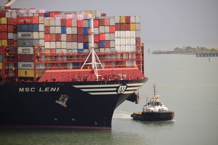 'MSC Leni' escorted by a tug boat on her arrival to the port of Tanjung Pelepas, Malaysia.のeditorial素材