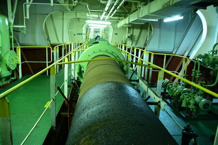 Propeller shaft on a large cargo ship. The propeller works by turning torque into thrust. In other words, it converts power from the engine into an action. Power is transmitted via propeller shaft.の写真素材