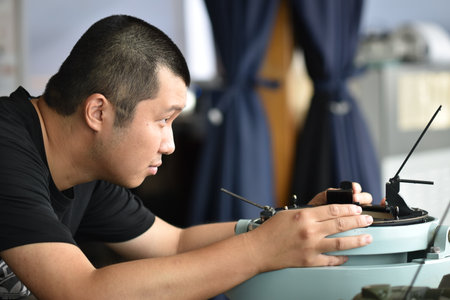 Young seaman making observation of a celestial body. Routine jobs for navigational officers.の写真素材