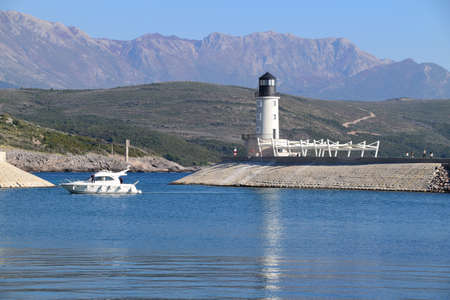 Light house at the entrance to luxury marina in Lustica Bay, Montenegro.の写真素材
