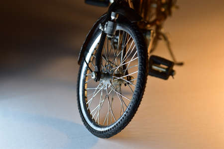 Toy model of a hand made bicycle with detail on front wheel.の写真素材