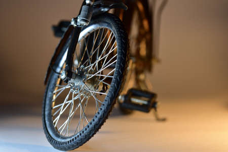 Toy model of a hand made bicycle with detail on front wheel.の写真素材