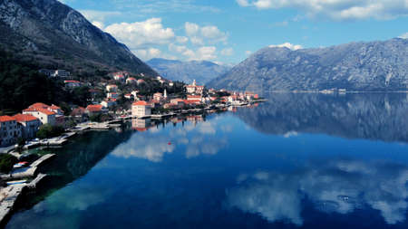 Prcanj small village near Kotor, Montenegro. known for its maritime past and beautiful scenery. Located in Bay of Boka Kotorska. Photo taken with drone on sunny day.の写真素材