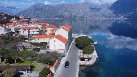 Prcanj small village near Kotor, Montenegro. known for its maritime past and beautiful scenery. Located in Bay of Boka Kotorska. Photo taken with drone on sunny day.の写真素材