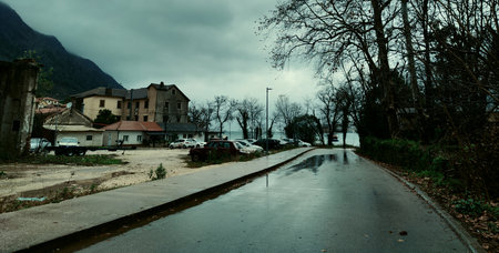 Village in the mountains with cloudy sky and rain. Toned.の写真素材