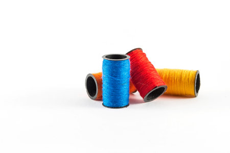Sewing threads on white background