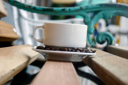 Coffee Mug on Wooden Chairの写真素材