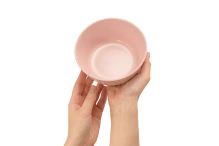 Pink dish in woman hands isolatedの写真素材