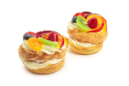 Home made cake with cream and fruit isolatedの写真素材