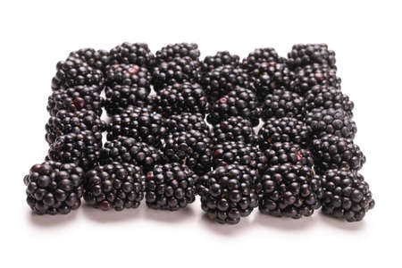 Tasty blackberry in a row isolated on whiteの写真素材