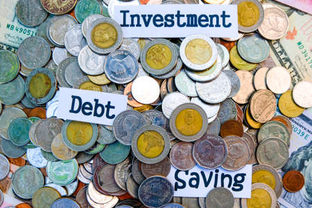 Heap of coins for investment saving and debt concept. Fractional coins concept.の写真素材