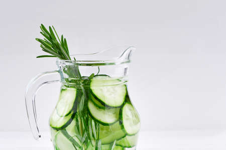 Cucumber and Rosemary Infused Water on wooden tableの写真素材