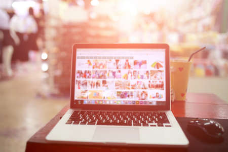 laptop desktop shopping online and mall blurred backgrounds.の写真素材