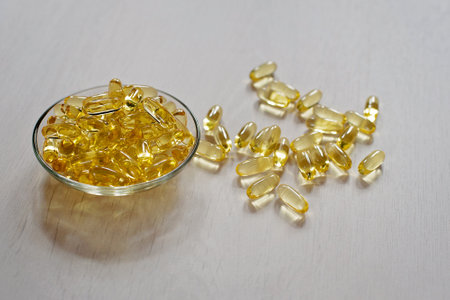 Fish oil pills. Omega-3 gel capsules. Food supplement obtained from cod liver. Healthcare and medical concept.の写真素材