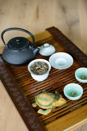 Tea ceremony process set for tea ceremony on a tea board with white Chinese tea.の写真素材