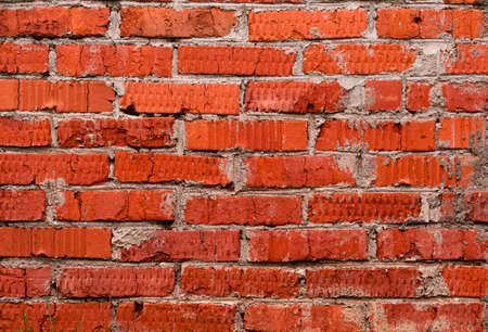 Uneven red brick wall background. Horizontal orientationの写真素材