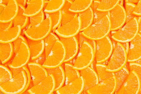 Slices of oranges as a background, top view.の写真素材
