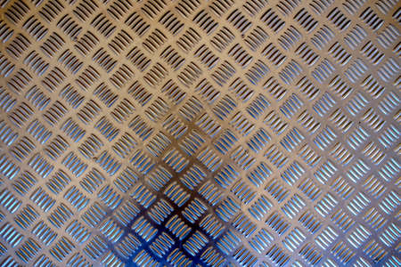 Background texture of metal with repetitive patternの写真素材