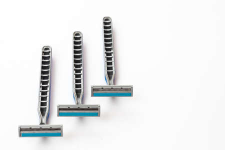 Blue men razor isolated on white background.の写真素材