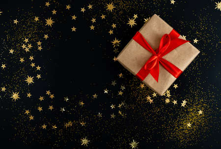 Gift boxes with gold ribbon on shine backgroundの写真素材