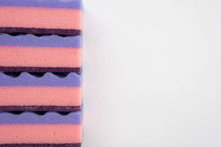 Multi-colored sponges for washing dishes isolated on a white background. Copy spaceの写真素材