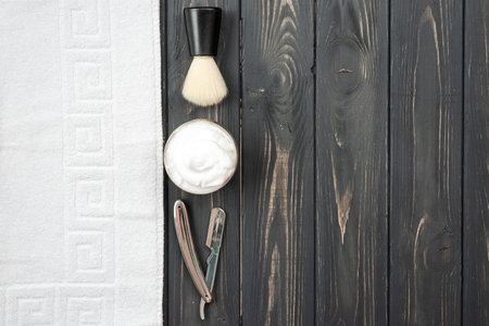 Image of shaving tools: brush, foam, shaver, towel.の写真素材
